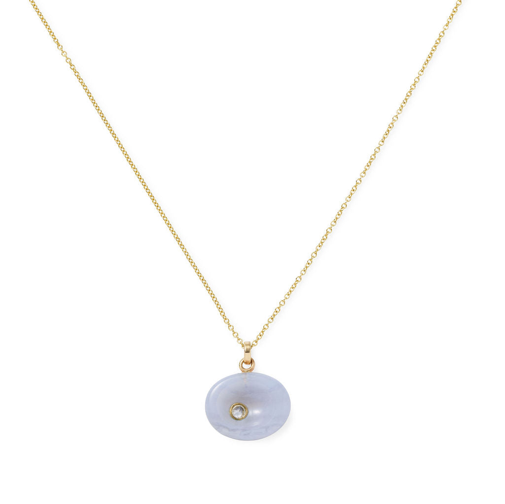 AnaKatarina Chalcedony Pebble pendant with an inverted-set diamond in a 14k gold bezel on a gold slider chain.