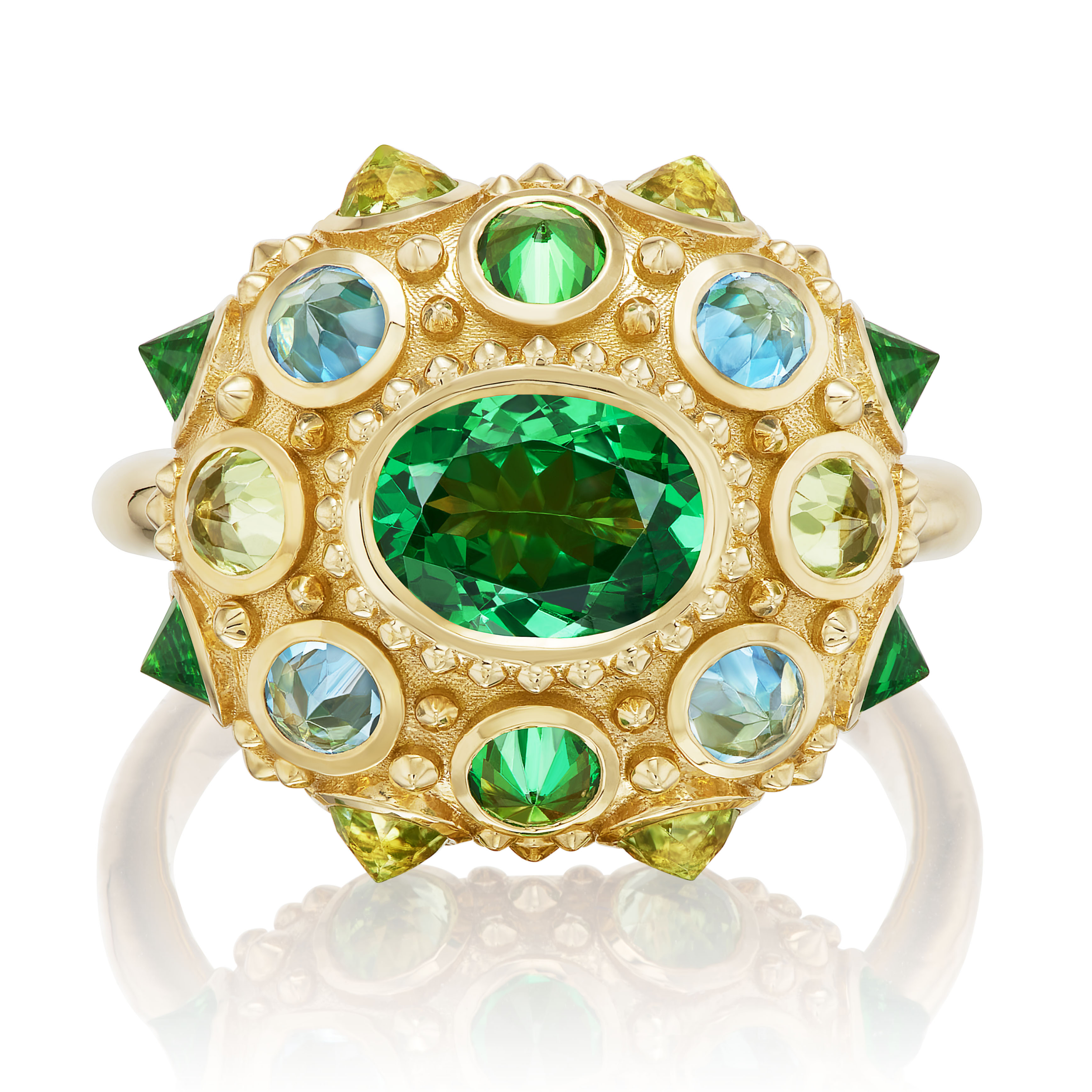 A top-down view of an 18K Yellow Gold ring designed by AnaKatarina featuring a vibrant arrangement of Tsavorite Garnets, Aquamarines & Peridot in the colors of blue & green creating a captivating & colorful display.