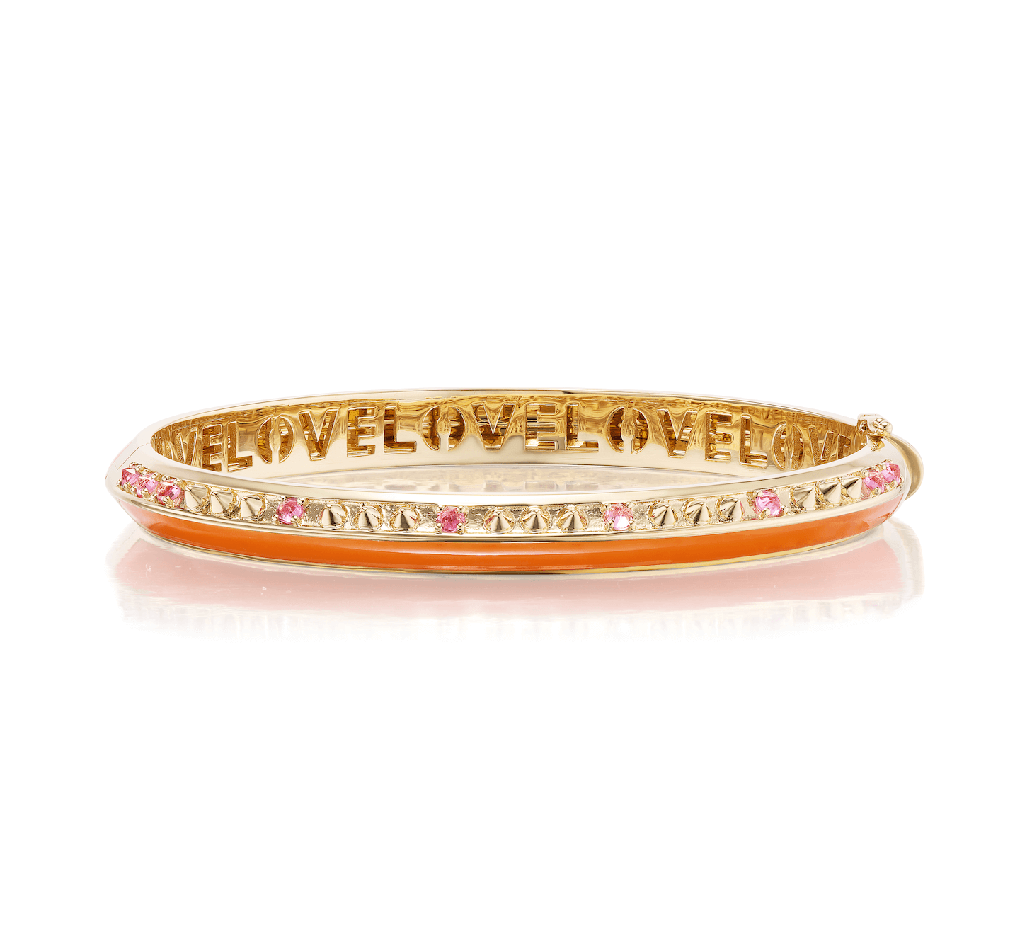 A side view of an elegant bangle bracelet designed by Ana-Katarina Fine Jewelry and crafted from 18k yellow gold and embellished with .40tw inverted pink tourmaline, gold spikes, and orange enamel. The word "love" is etched in the gold inside the bracelet.