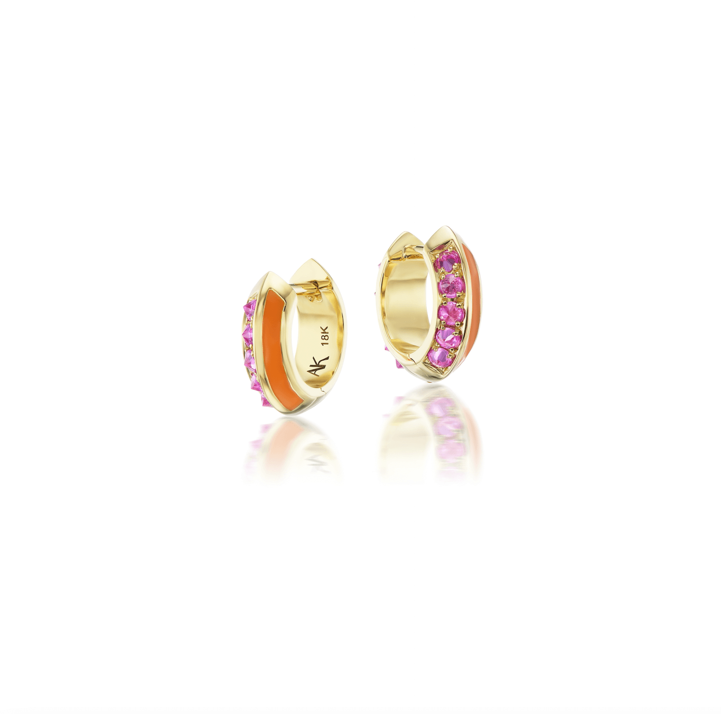 A frontal view of exquisite gold and pink sapphire earrings designed by Anna Katarina. These 'Sweet, Happy Life' Huggies earrings feature .48tw pink tourmaline and orange enamel for a touch of elegance.