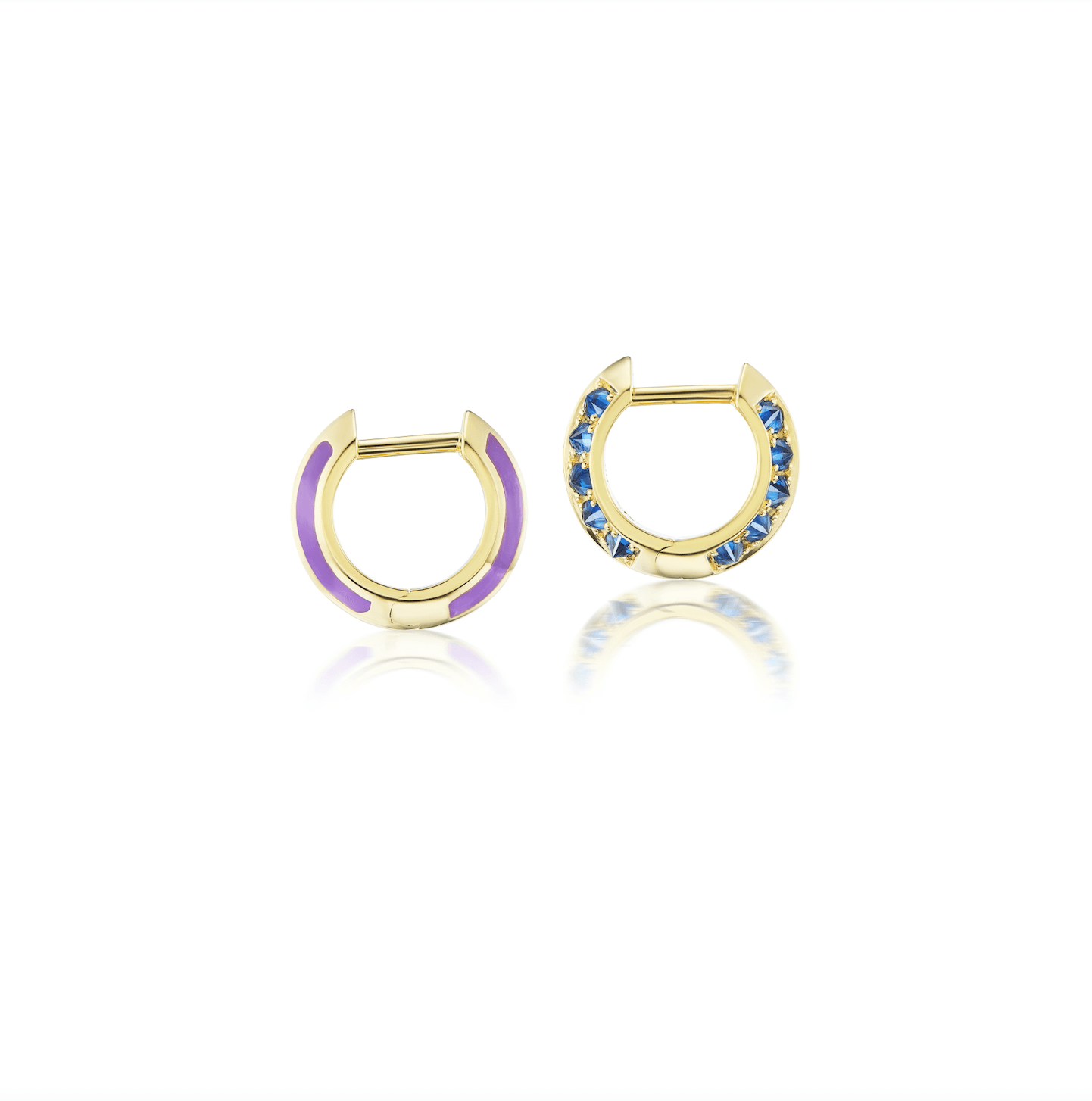 A side view of the 'Sweet, Happy Life' Blue Sapphire Drop Huggie earrings in 18k yellow gold, embellished with alluring .62tw Blue Sapphires and Lavender Enamel designed by Ana-Katarina Fine Jewelry.