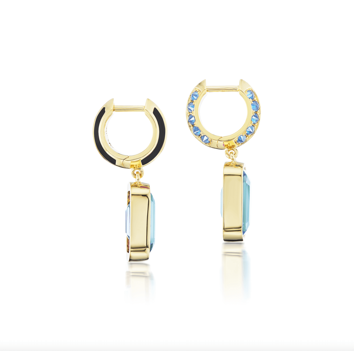 A side view of the exquisite 'Sweet, Happy Life' Blue Topaz Drop Earrings meticulously crafted by AnaKatarina with a blue topaz drop, 18k yellow gold spikes, and embellished with .48ct inverted blue sapphires and black enamel for a touch of sophistication. Designed by Ana-Katarine Fine Jewelry.