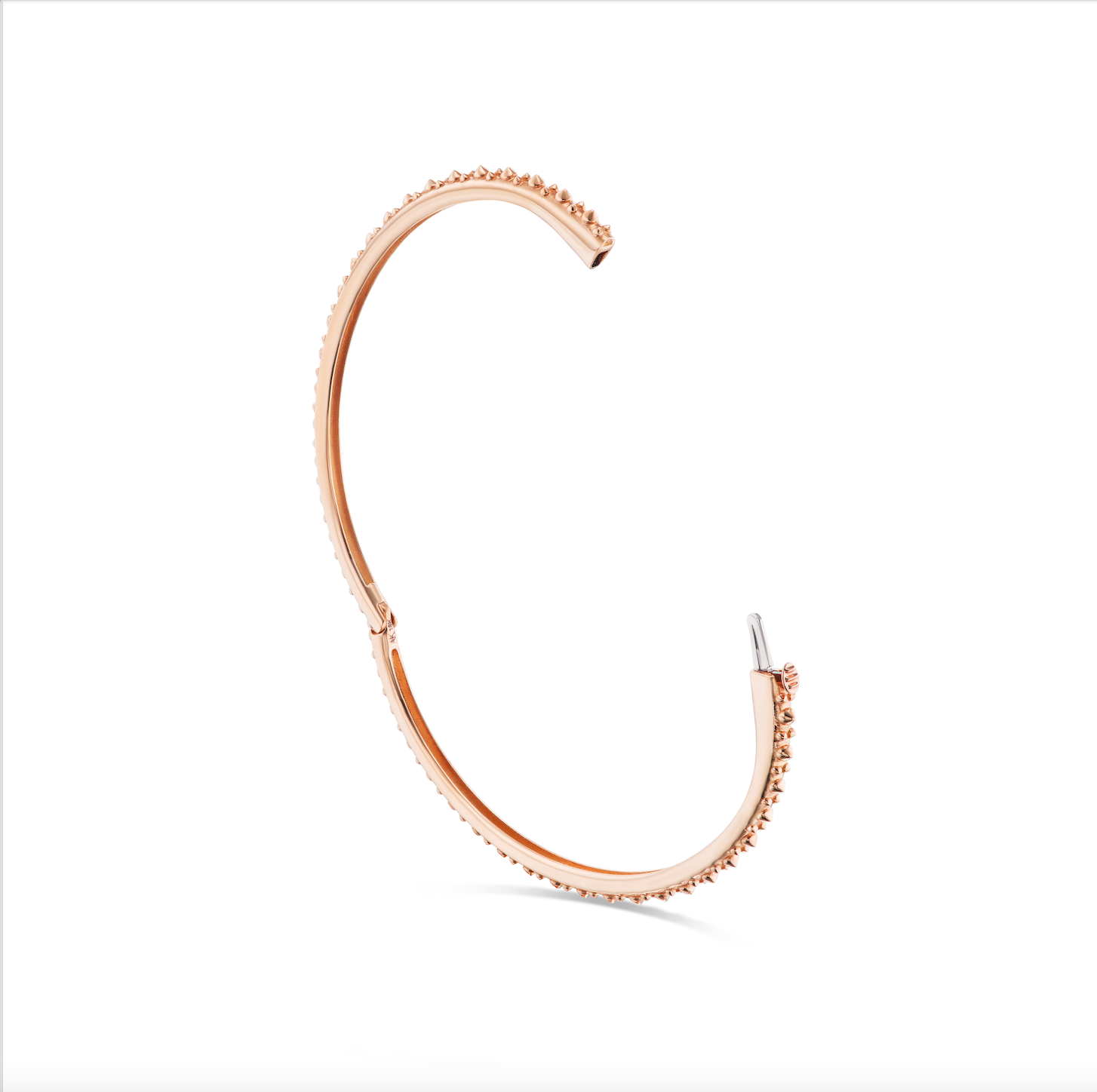 An open view of AnaKatarina's Attitude Rose Gold 'Adrina Loves a Bangle' 18 karat rose gold bangle. In her reinvention of the classic bangle, AK combines traditional form with a fusion of confidence and femininity, showcasing luxurious 18k gold sp