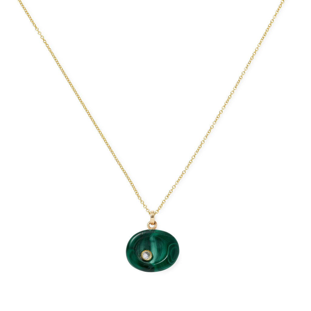 AnaKatarina Malachite Pebble pendant with natural green banding and an inverted-set diamond in a 14k gold bezel on a gold slider chain.
