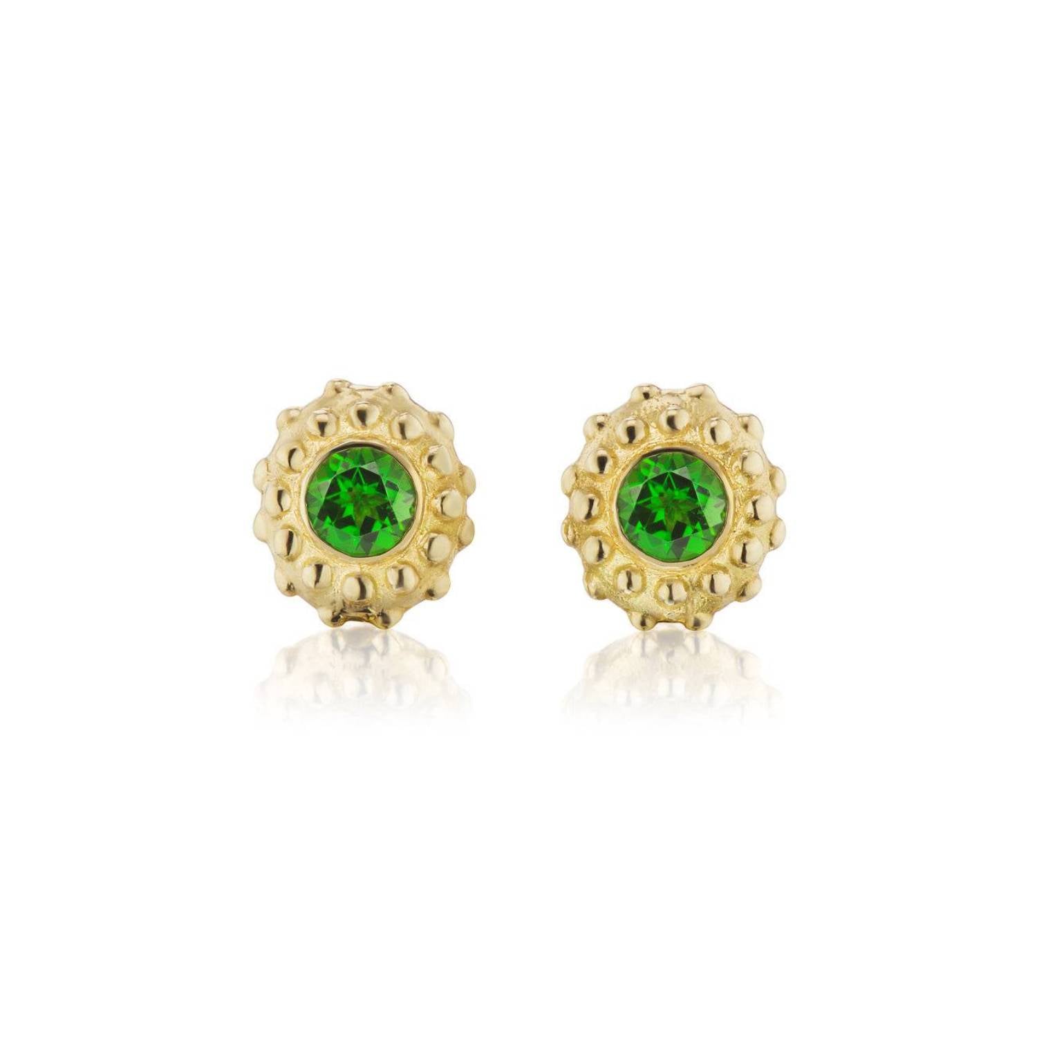 A set of 18k yellow gold and inverted green tsavorite garnet stud earrings with soft gold beading in the setting designed after the delicate design of a sea urchin by Ana-Katarina Fine Jewelry.