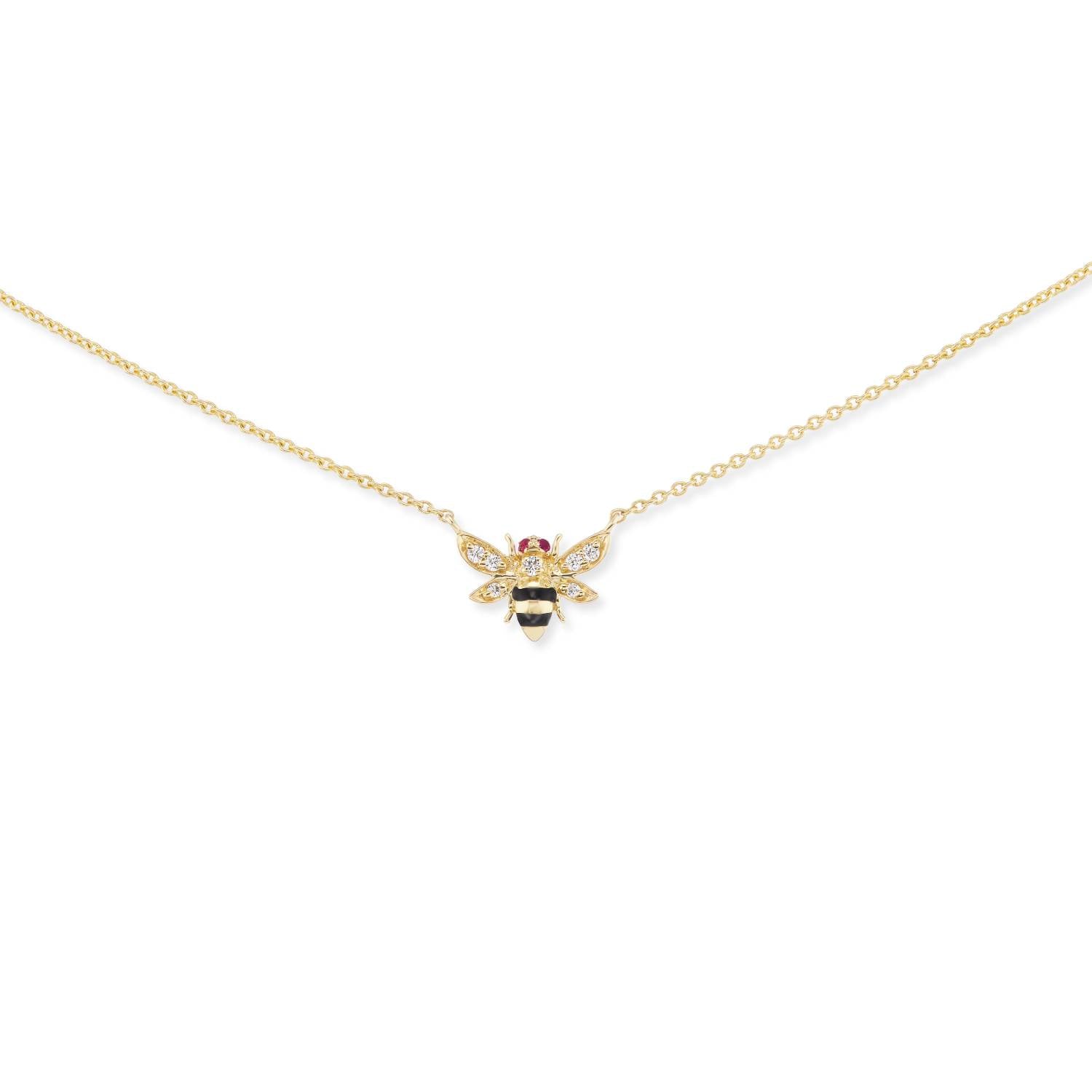 A Bee Charm Necklace: expertly designed and crafted in 18k yellow gold with diamond wings, ruby eyes, and black enamel and gold stripes on a gold chain. Designed by Ana-Katarina Fine Jewelry.