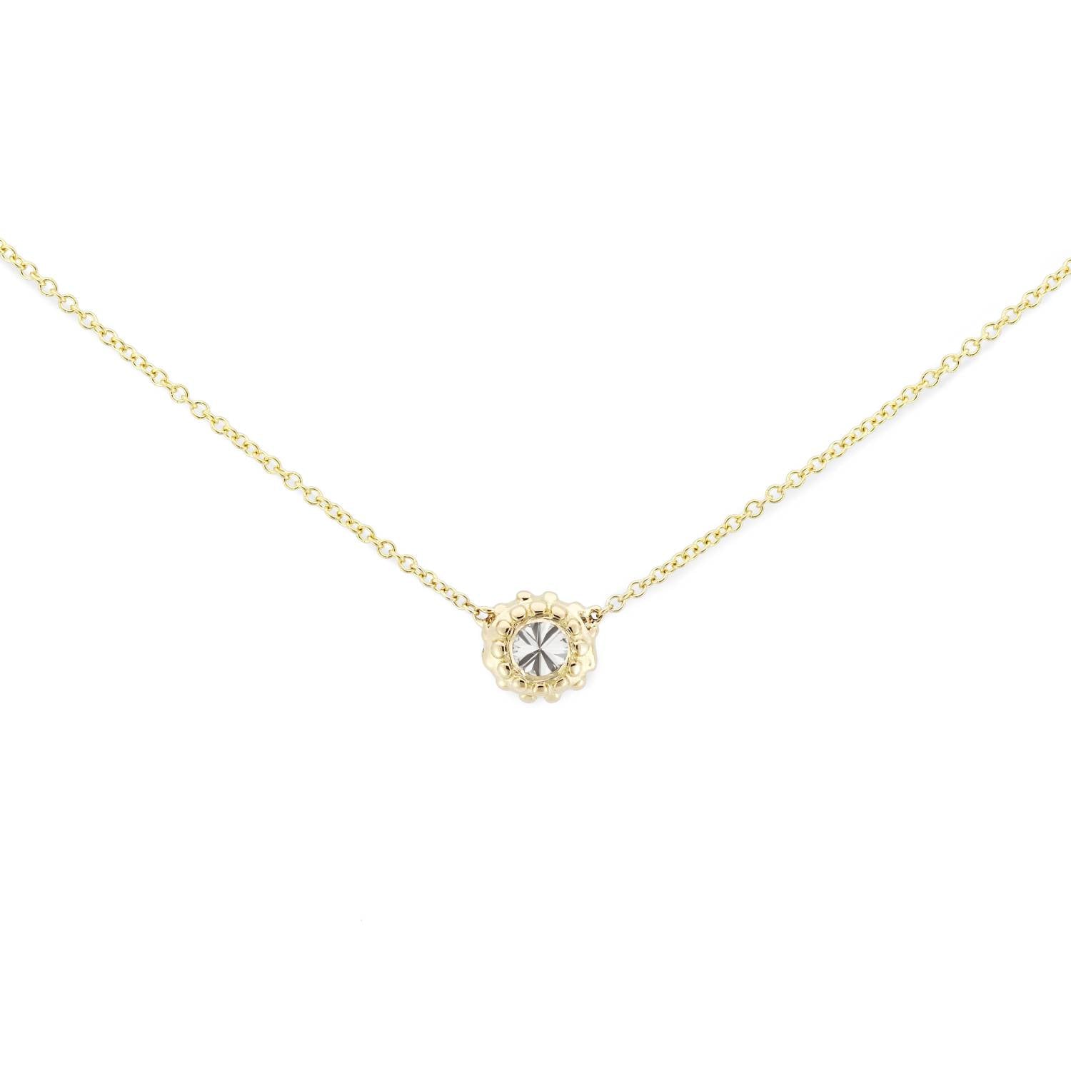 A delicate 18k yellow gold and inverted diamond solitaire necklace with an adjustable 18" cable chain inspired by the totemic symbolism of the sea urchins along the California coast and designed by Ana-Katarina Fine Jewelry.