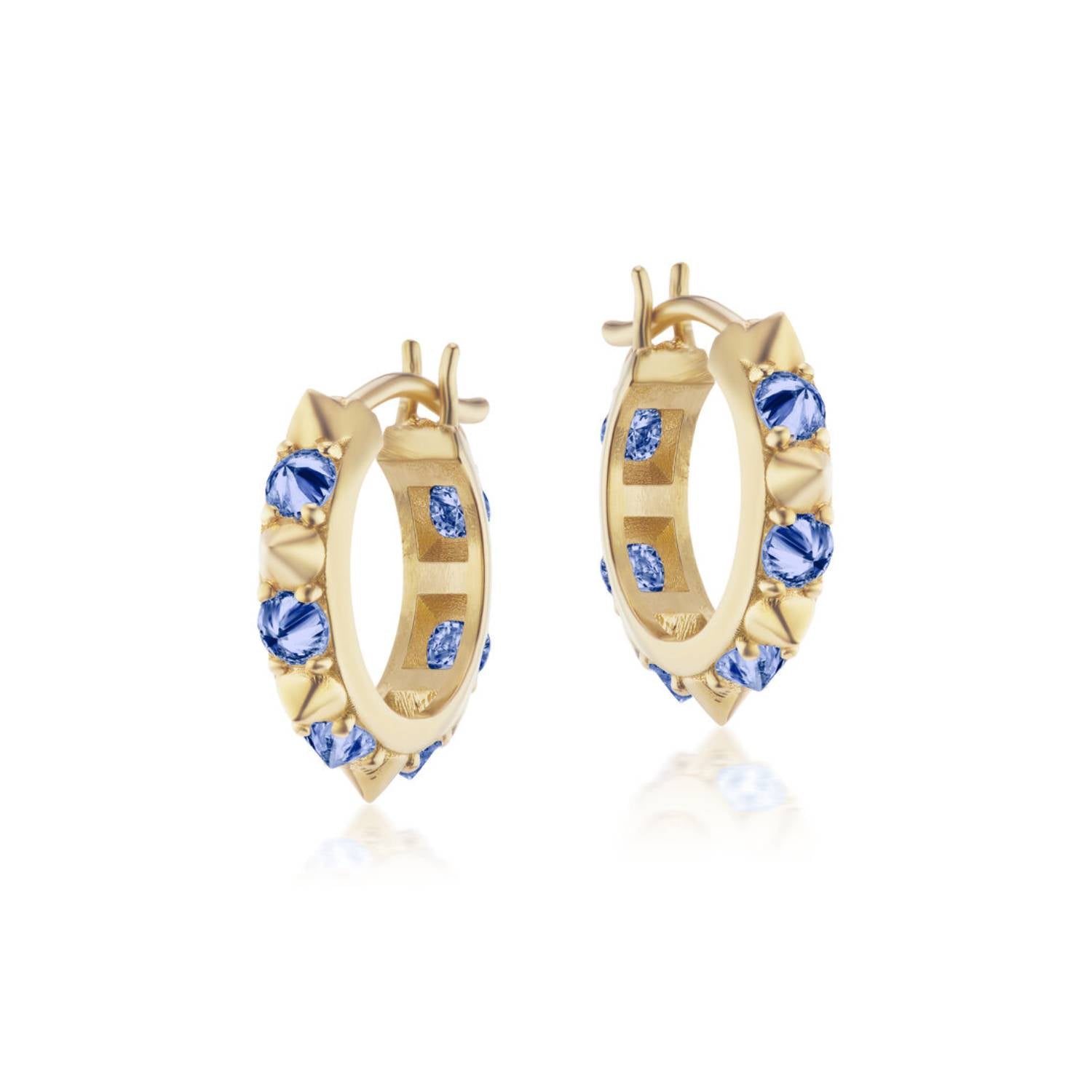 A side view of the 'Attitude' Valerie Blue Sapphire Mini Hoops in blue and yellow, crafted with 18k yellow gold and adorned with inverted blue sapphire and gold spikes, they're a reinvented classic mini gold hoop earring.