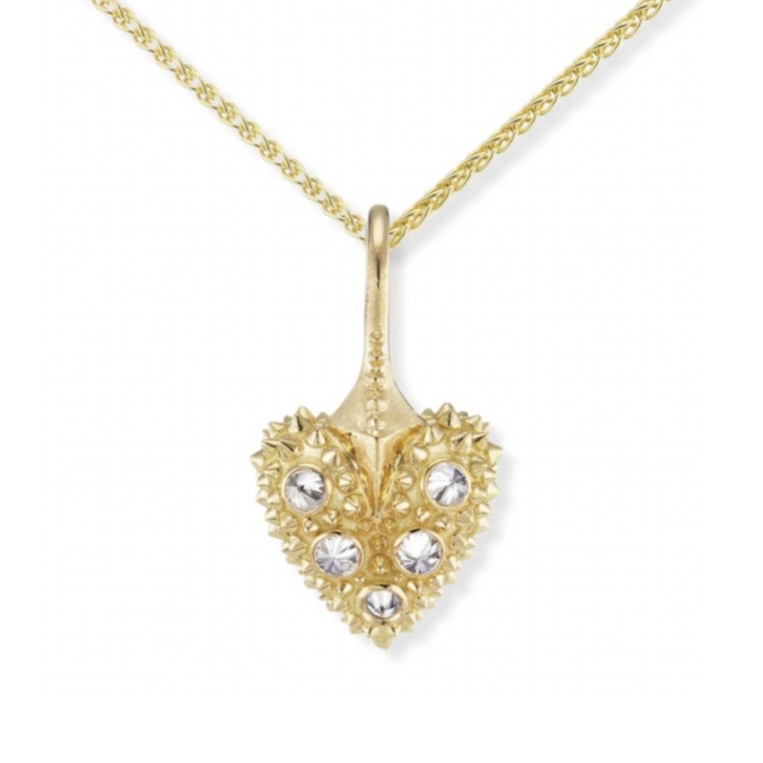 An 18k yellow gold heart necklace with inverted diamonds & soft gold spikes on a gold chain - designed by Ana-Katarina Fine Jewelry.