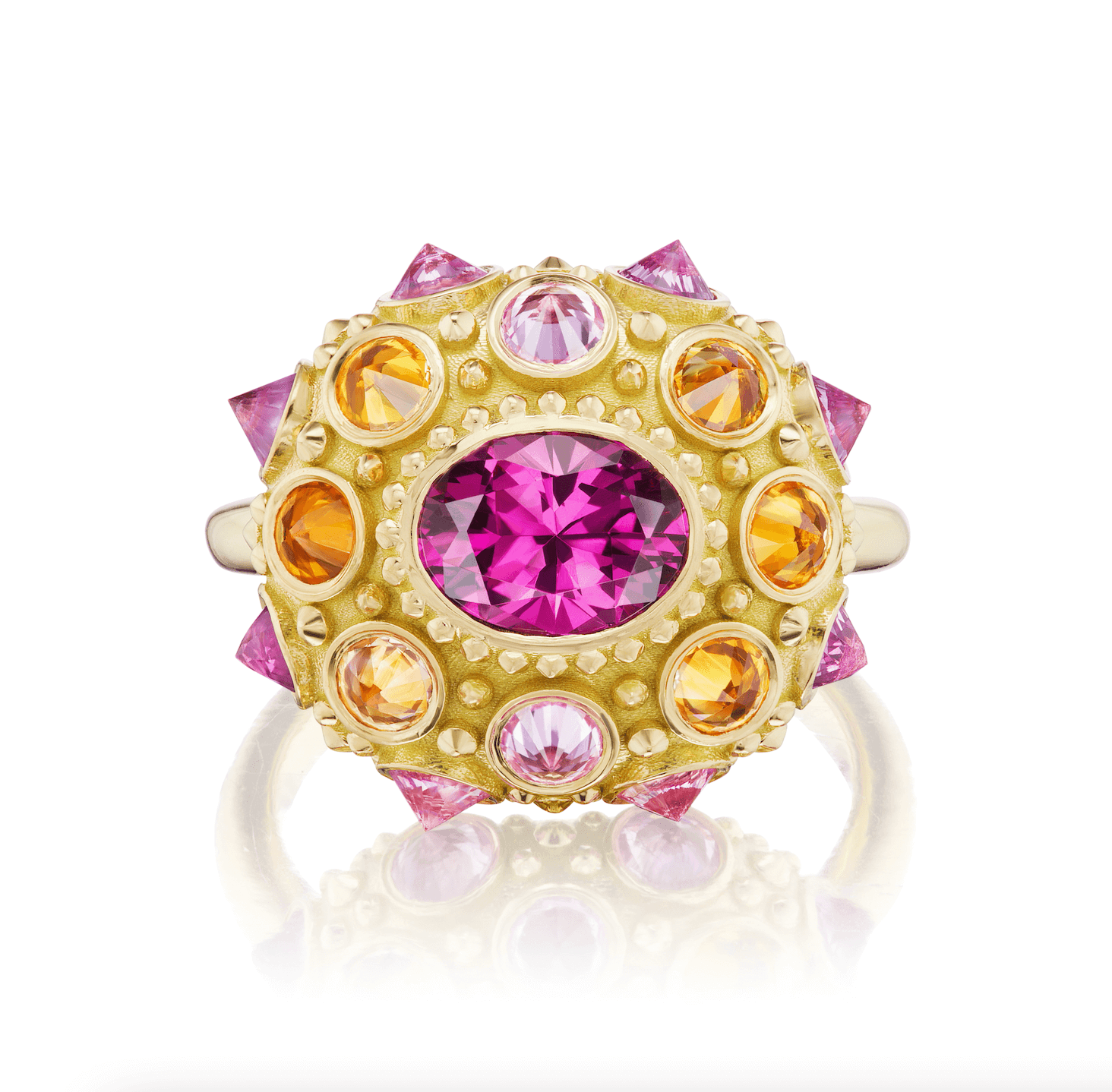 A top-down view of an exquisite 18K yellow gold and precious gemstone ring designed by AnaKatarina Fine Jewelry. Adorned with inverted Rhodalite Garnets, Pink Sapphires, and Orange Sapphires this playfully stunning ring features a large, captivating diamond-cut pink sapphire in the center as its focal point.