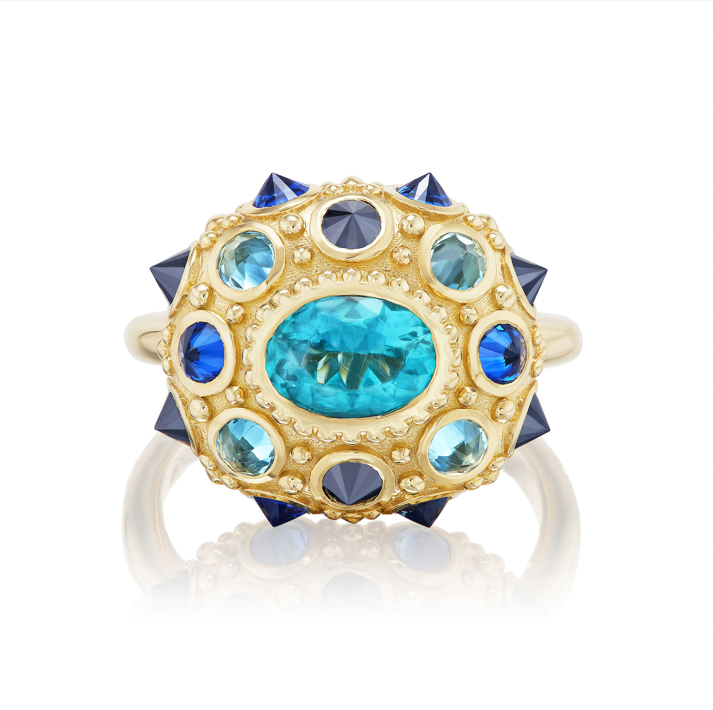 Crafted in 18k yellow gold, adorned with 1.18ct Apatite, .44ct Aqua, .73ct Blue Sapphire, and .75ct Black Diamond. Oval blue topaz ring featuring an exquisite design inspired by the delicate beauty of the sea urchin. Engraved with 'LOVE' underneath.