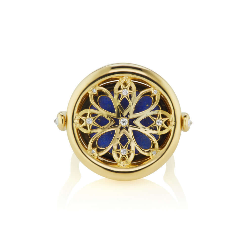 An 18k yellow gold ring with blue enamel and a flower design. The flip side features a celestial scene or quantum interconnectivity of the galaxy. Can be worn as a pendant with a 4 Elements Chain and a charm holder. Lapis is sustainably mined in Chile and cut in NYC.