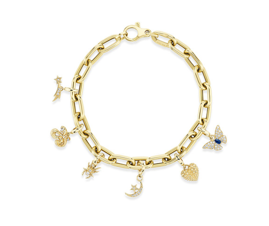 AK 18k gold Charm Bracelet worn alone on the wrist