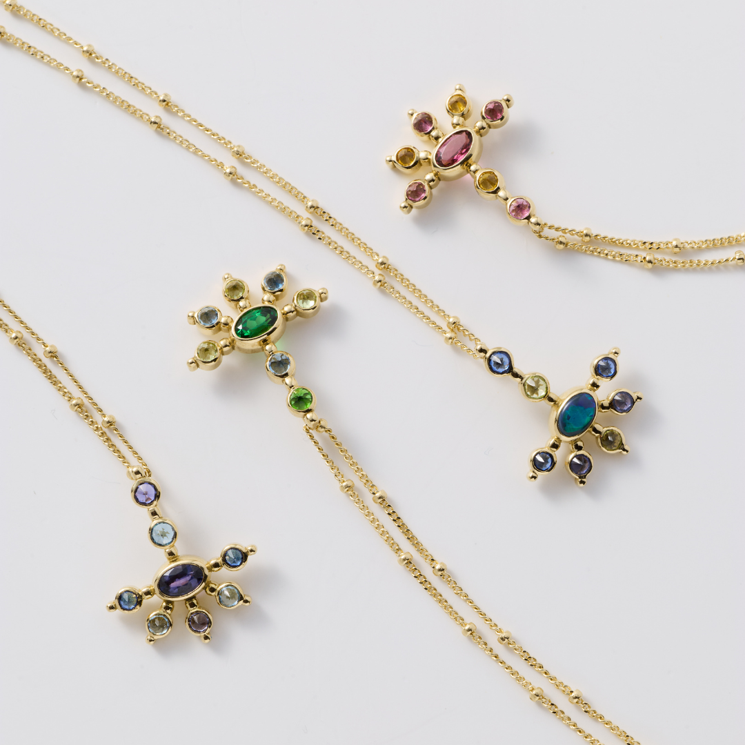 AnaKatarina Mini Funny Valentine necklaces displayed together, featuring colorful gemstones and sea urchin-inspired gold designs.