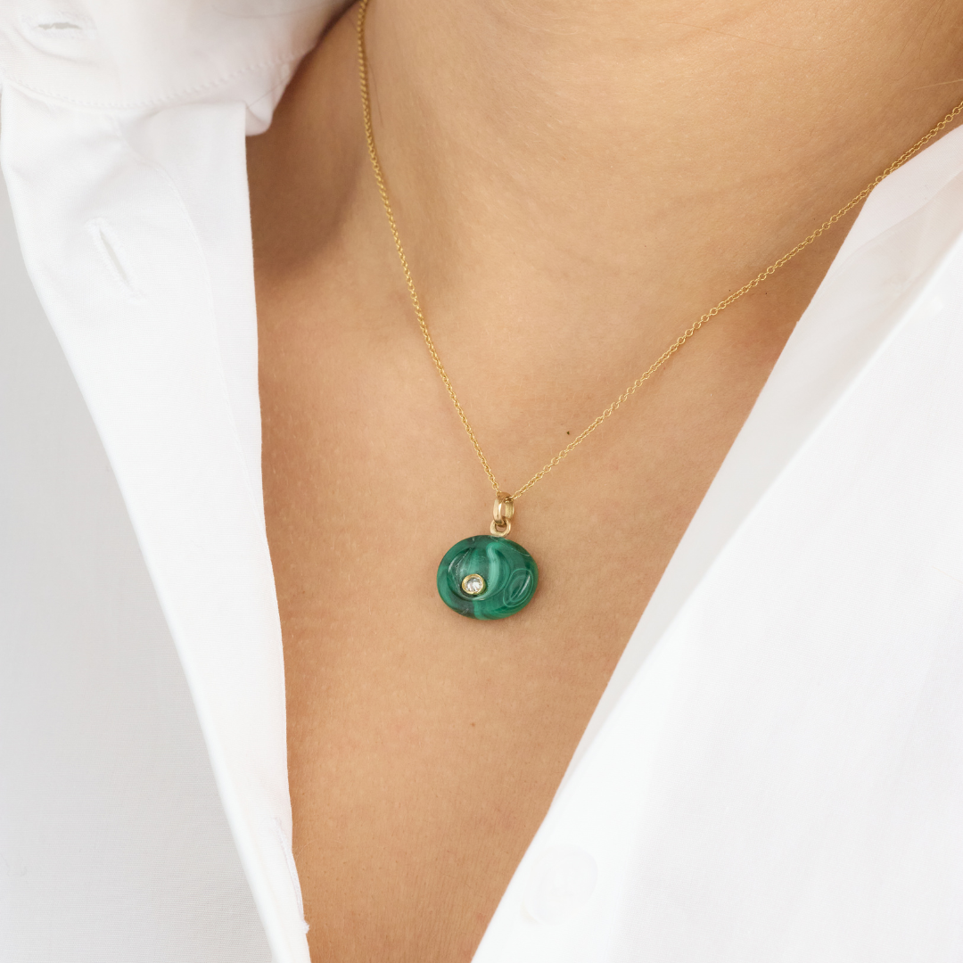 Model wearing AnaKatarina’s Malachite Pebble diamond pendant on an adjustable 14k gold slider chain.