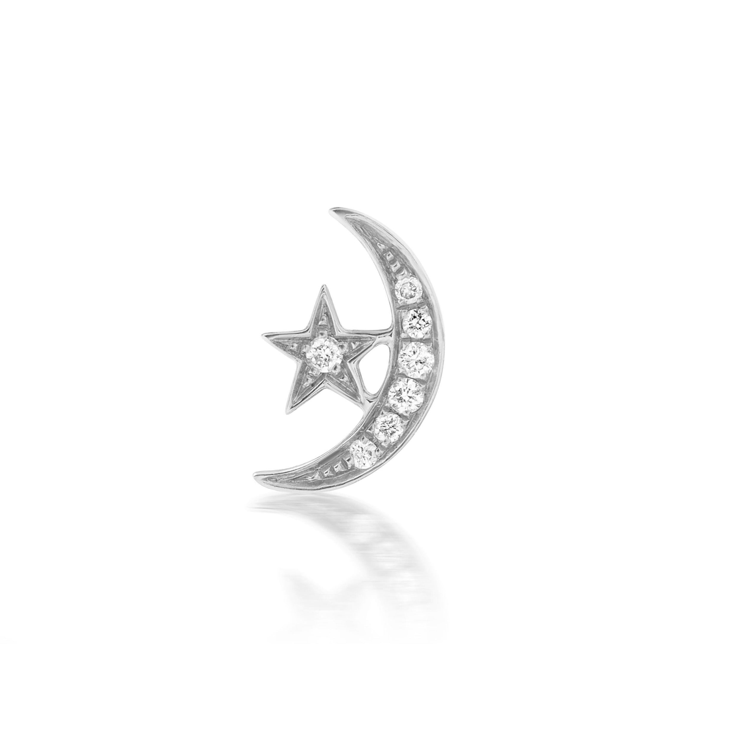 A close-up of Ana-Katarina’s 4 Elements: 'Air' Star & Moon Stud Earring in 18k white gold & diamonds against a white background.  
