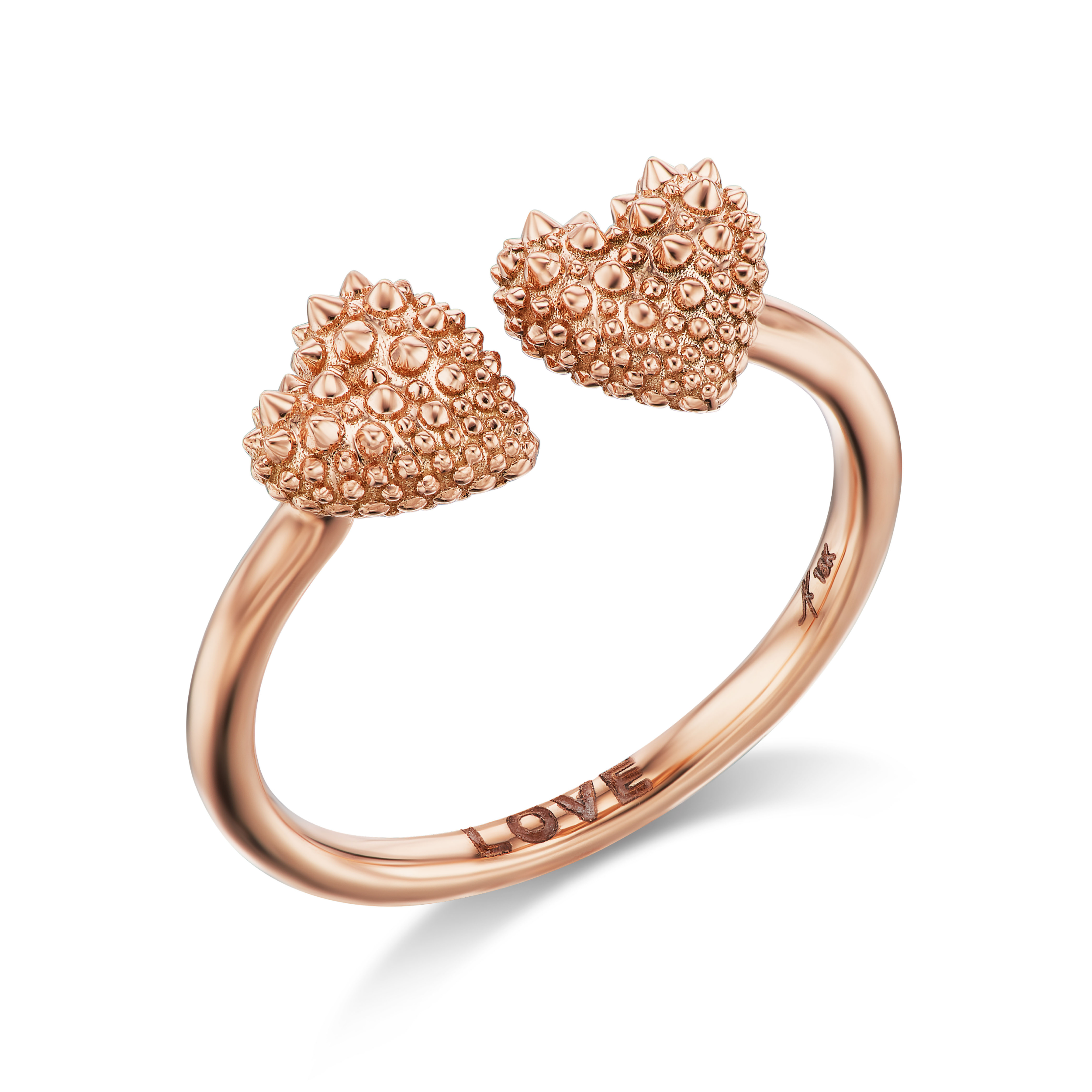 An 18k rose gold ring with two spiked hearts side by side for a new spin on the classic 'moi et toi' design. The word 'love' is shown engraved inside the band of the ring designed by Ana-Katarina fine jewelry.