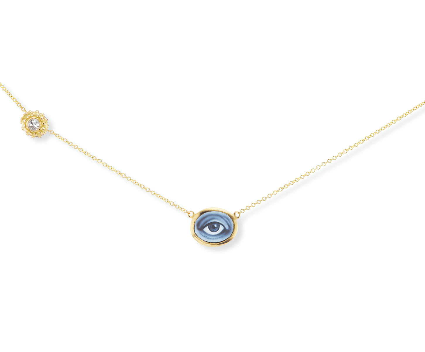 An 18k yellow gold & diamond necklace with a blue agate ‘Eye Love’ Cameo of a human eye set on a gold chain with an inverted diamond charm. Designed & hand-crafted by Ana-Katarina Fine Jewelry