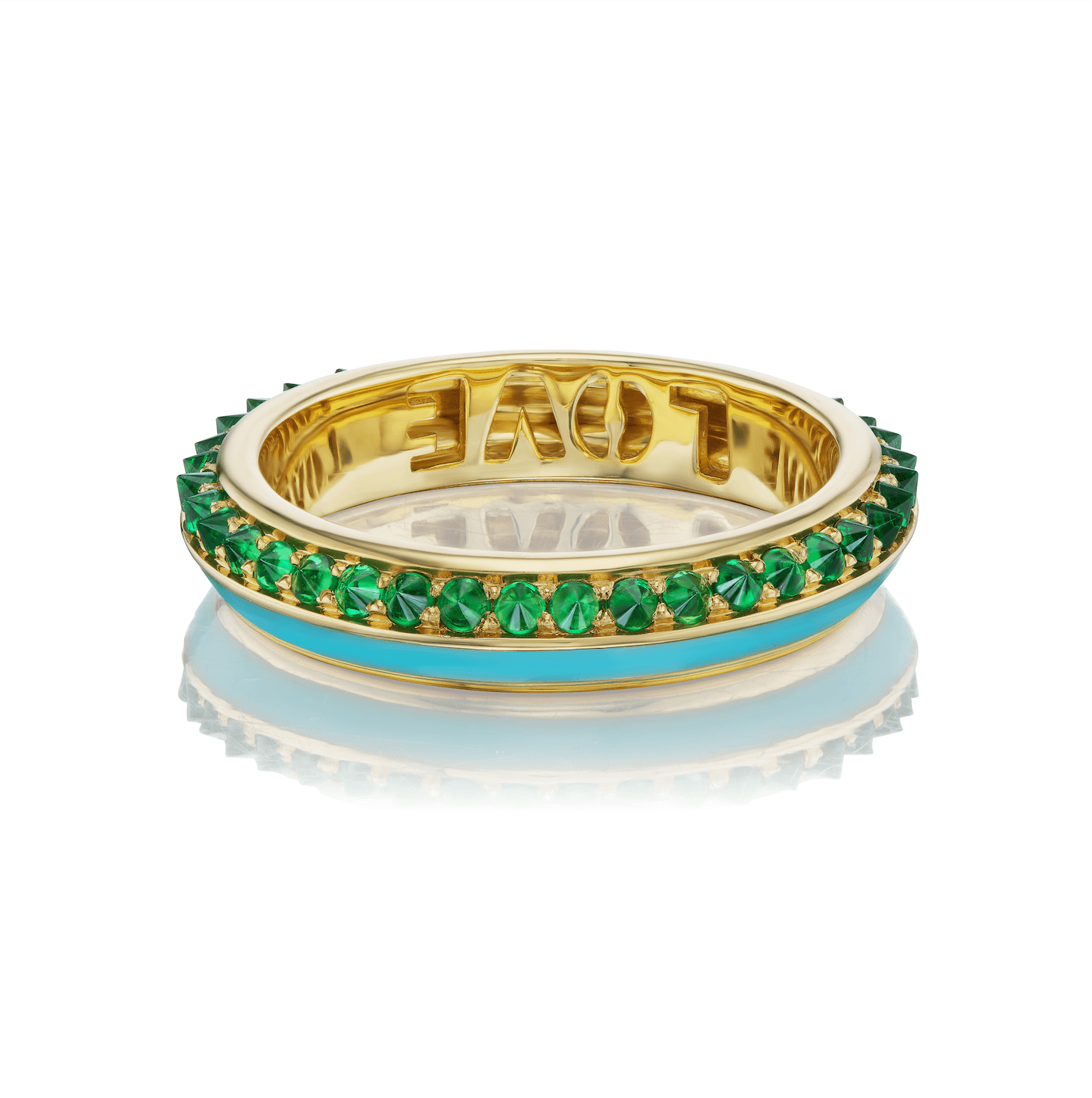 The side view of the lavish 'Sweet, Happy Life' Tsavorite Garnet Stacking Ring designed by Ana-Katarina Fine Jewelry, showcasing a captivating combination of green, turquoise, and gold hues, adorned with a .72tw Tsavorite Garnet and Turquoise Enamel details. The word 'love' is carved into 18k yellow gold inside this charming ring. 