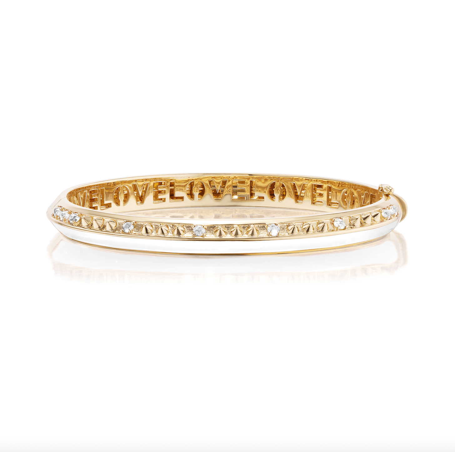A side view of AnaKatarina's stunning 'Sweet, Happy Life' Drop Diamond Bangle. Crafted with 18k yellow gold, .50tw diamonds, and white enamel, it's the perfect addition to your jewelry collection. The word ‘love’ is inset in gold inside the bracelet. Designed by Ana-Katarina Fine Jewelry.