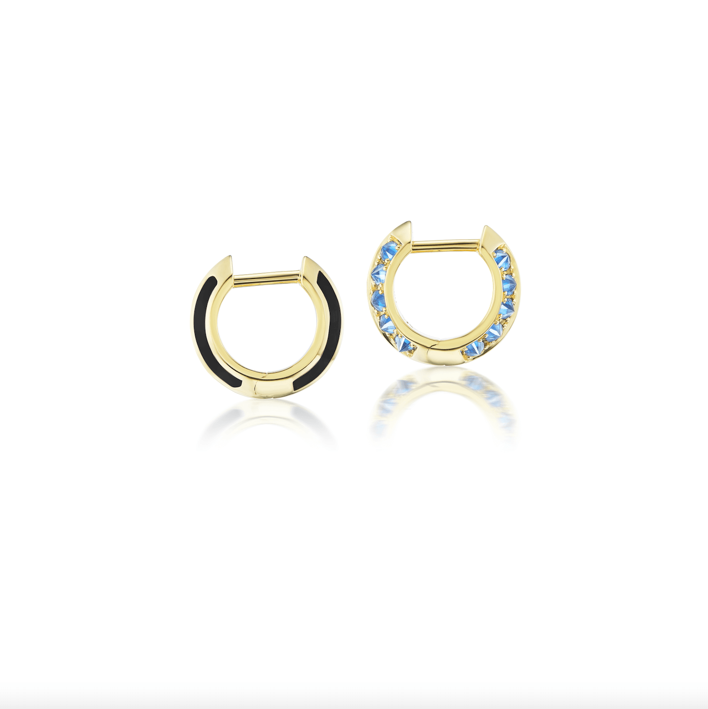 A side view of AnaKatarina's 'Sweet, Happy Life' Blue Topaz Drop Huggies: Luxurious 18K yellow gold and blue earrings adorned with .62 carat blue topaz and black enamel.