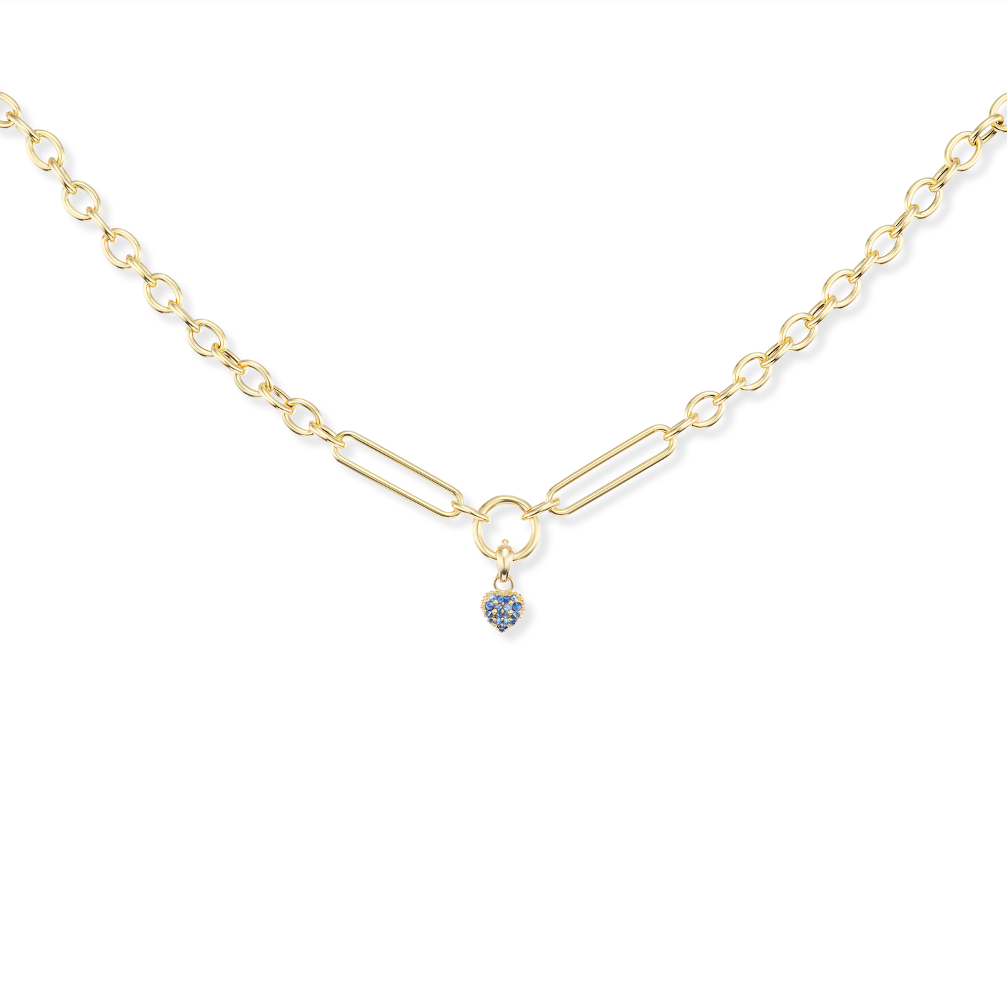 The ‘Pierce Your Heart’ blue sapphire heart charmlette pendant shown on an 18k yellow gold Olivia Chain both designed by Ana-Katarina Fine Jewelry. 