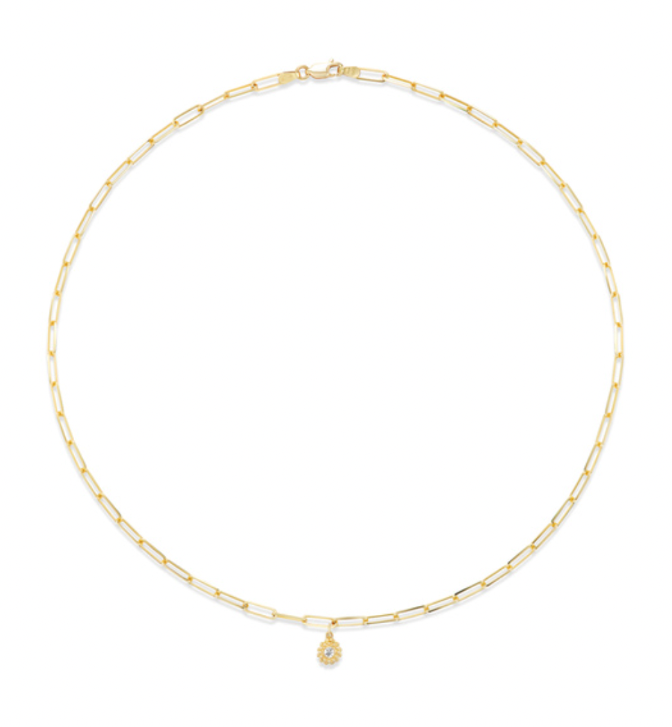 A view of a stunning diamond solitaire pendant on an adjustable 18”, 18k yellow gold paper clip chain. The pendant has a sea urchin design with 18k yellow gold beading to represent the spines of the sea urchin. 