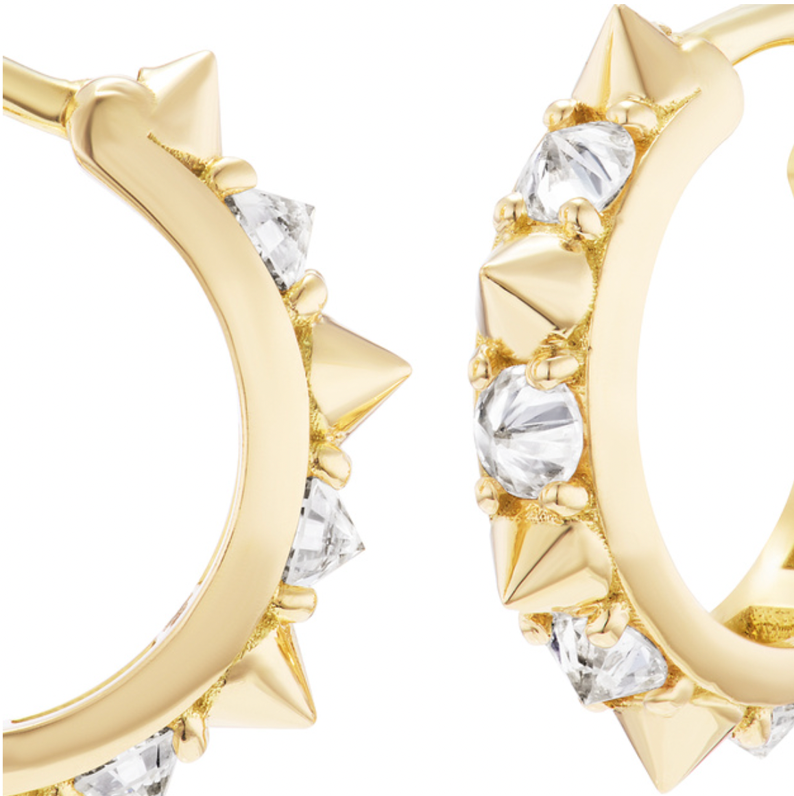 A close-up view of the Attitude ‘Valerie’ Diamond Mini Hoop Earrings in 18k yellow gold by Ana-Katarina Fine Jewelry are shown from the side and front to show the inverted diamonds, 18k yellow gold spikes, and saddleback closure. 