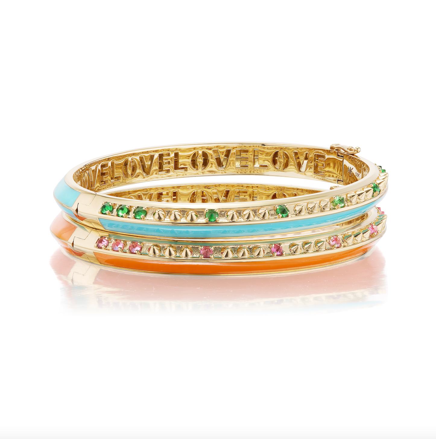 A side view of two bangle bracelets designed by Ana-Katarina Fine Jewelry stacked together. Both are crafted from 18k yellow gold. One is the 'Sweet, Happy Life' Pink Tourmaline Bangle embellished with .40tw pink tourmaline, gold spikes, and orange enamel. 