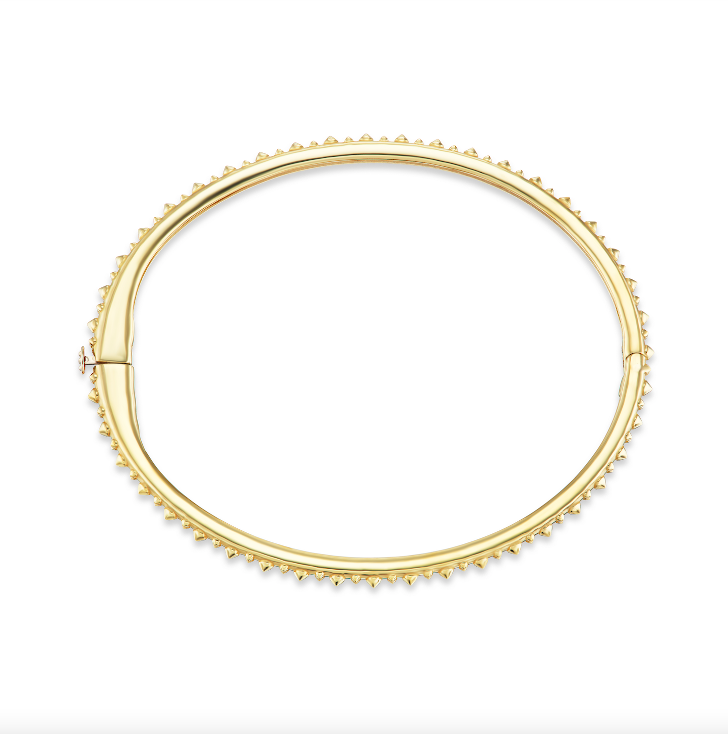 A full open view of AnaKatarina's Attitude Yellow Gold 'Adrina Loves a Bangle' 18K yellow gold bangle. In her reinvention of the classic bangle, AK combines traditional form with a fusion of confidence and femininity, showcasing luxurious 18k gold spikes 
