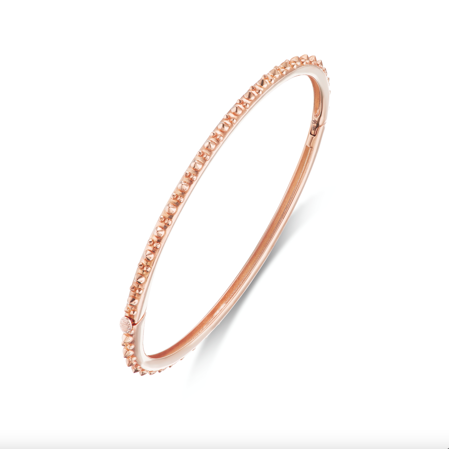 A perpendicular view of AnaKatarina's Attitude Rose Gold 'Adrina Loves a Bangle' 18 karat rose gold bangle. In her reinvention of the classic bangle, AK combines traditional form with a fusion of confidence and femininity, showcasing luxurious 18k gold sp