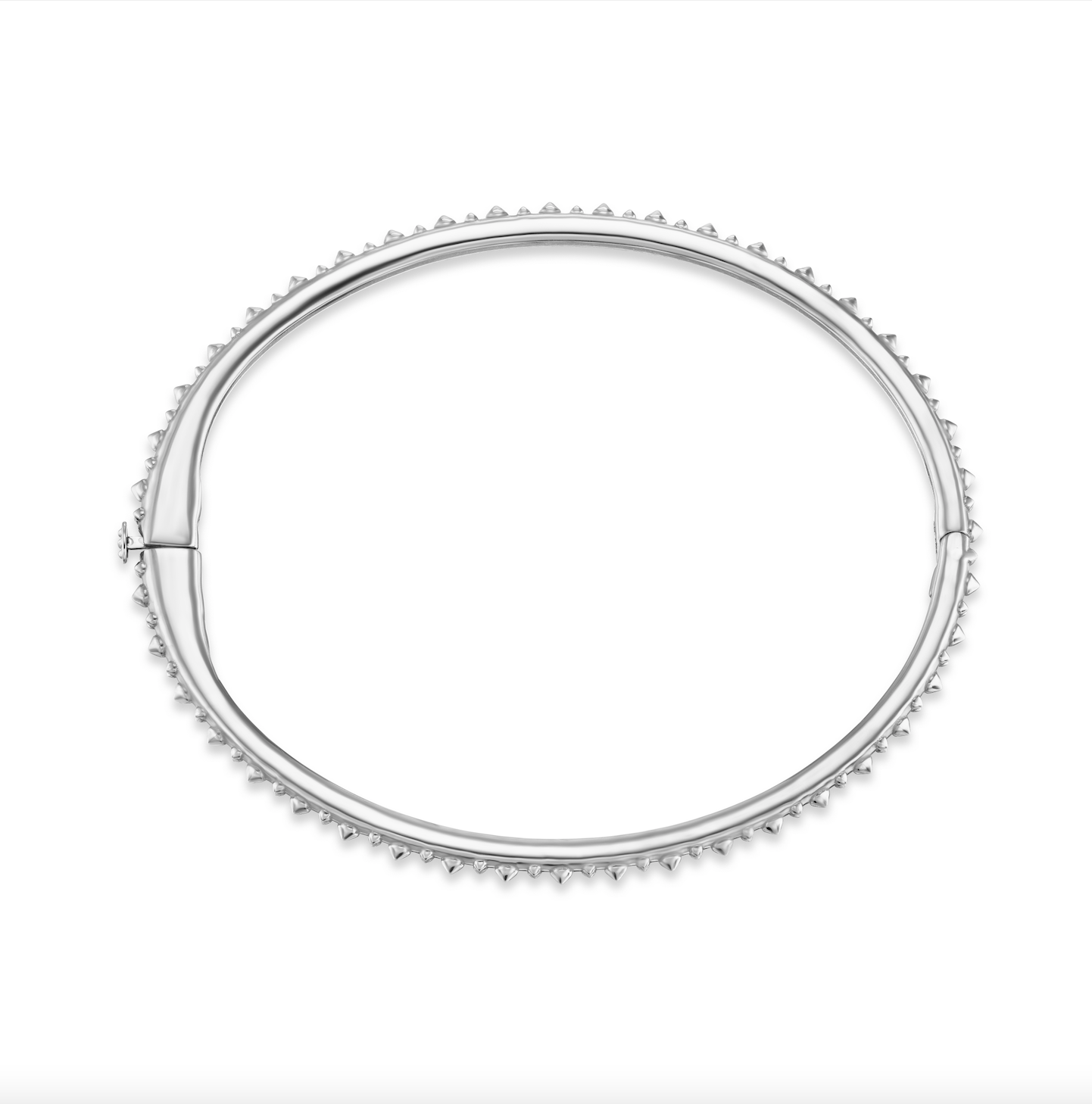 A full side view of AnaKatarina's Attitude White Gold 'Adrina Loves a Bangle' 18 karat white gold bangle. In her reinvention of the classic bangle, AK combines traditional form with a fusion of confidence and femininity, showcasing 18k gold spikes.