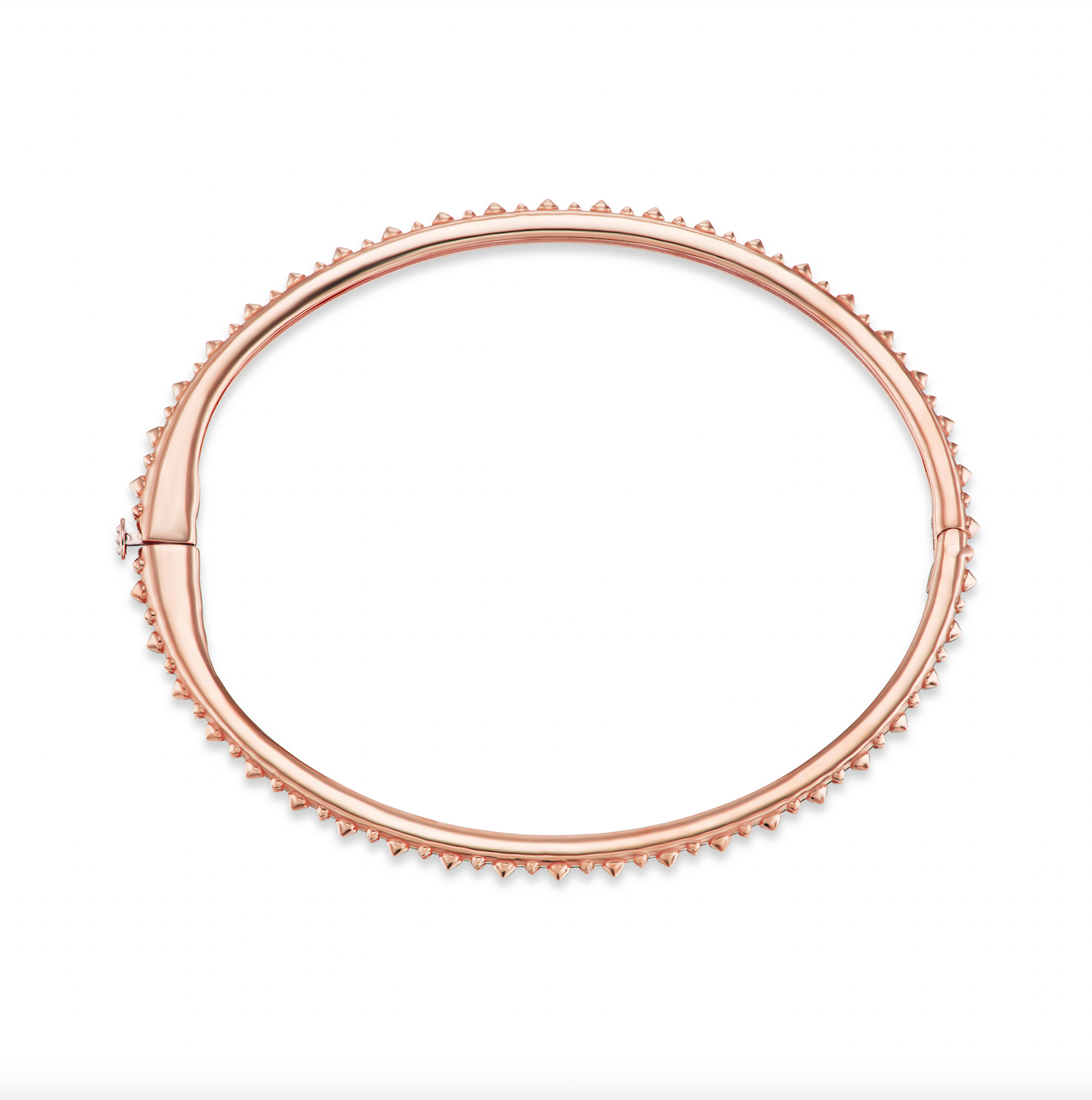 A full side view of AnaKatarina's Attitude Rose Gold 'Adrina Loves a Bangle' 18 karat rose gold bangle. In her reinvention of the classic bangle, AK combines traditional form with a fusion of confidence and femininity, showcasing luxurious 18k gold spikes