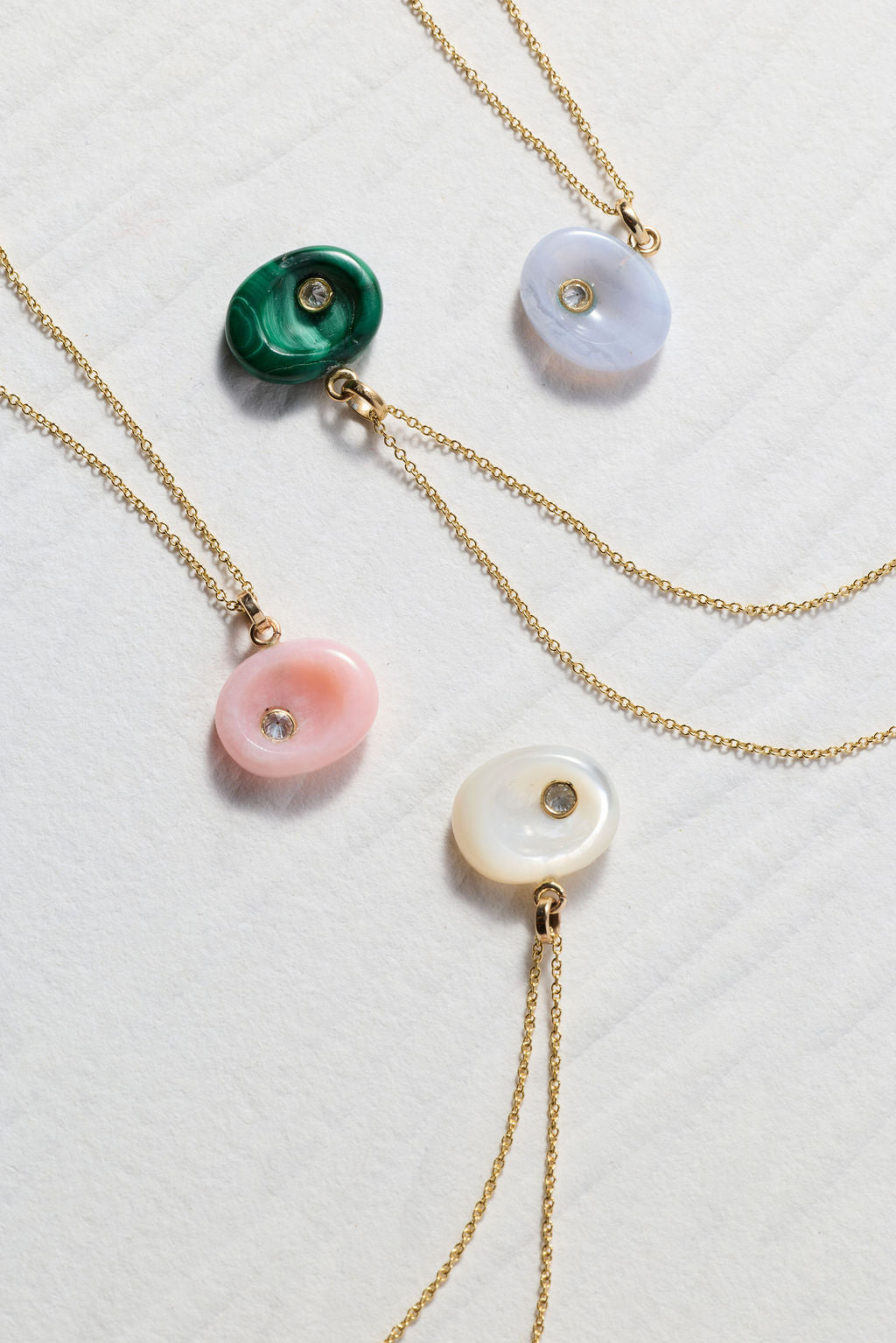 Model wearing AnaKatarina’s Malachite Pebble diamond pendant on an adjustable 14k gold slider chain.