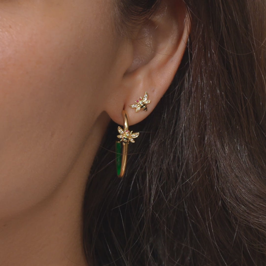 A video of a person modeling Ana-Katarina's fine jewelry from the 4 Elements Collection with a focus on the Bee Stud Earrings and Hoops. 