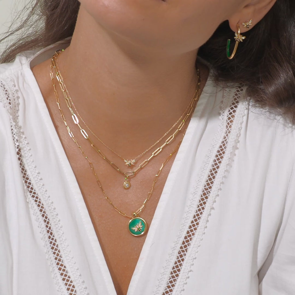 A video of a model wearing all four necklaces from Ana-Katarina’s ‘4 Elements’ collection, as well as stud earrings from Ana-Katarina fine jewelry. 
