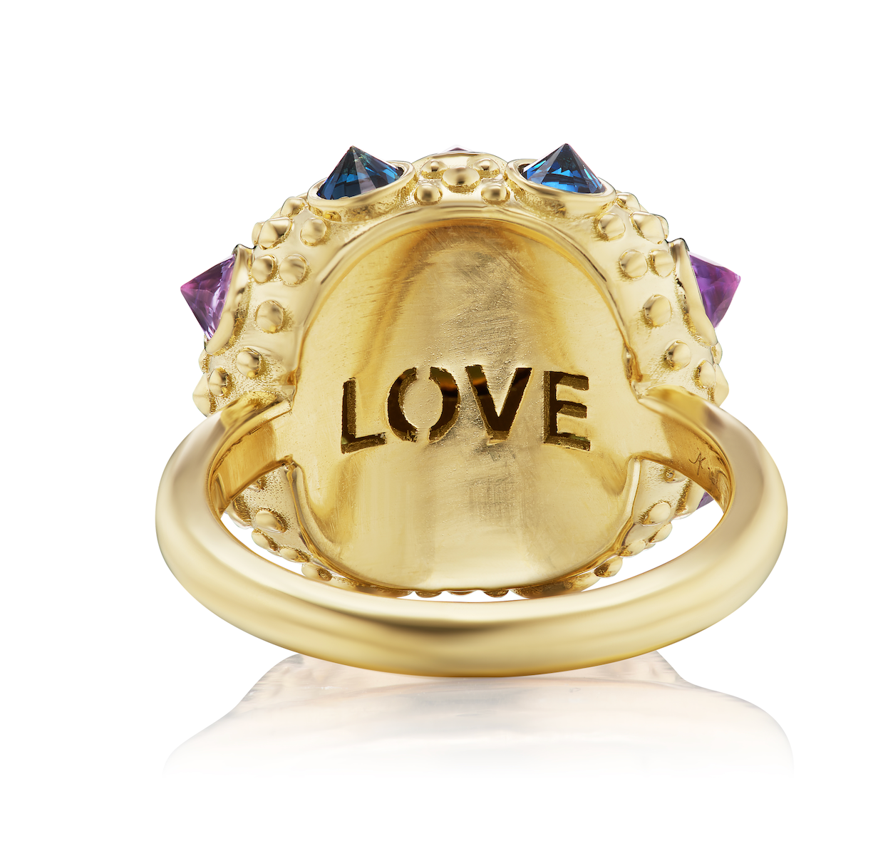 The underside of AnaKatarina's statement piece: the Blue Valentine Ring. Crafted from 18k yellow gold and adorned with a Lighting Ridge black opal and vibrant peridots, amethysts, and blue sapphires. With spiritual properties and an engraved 'LOVE', this 