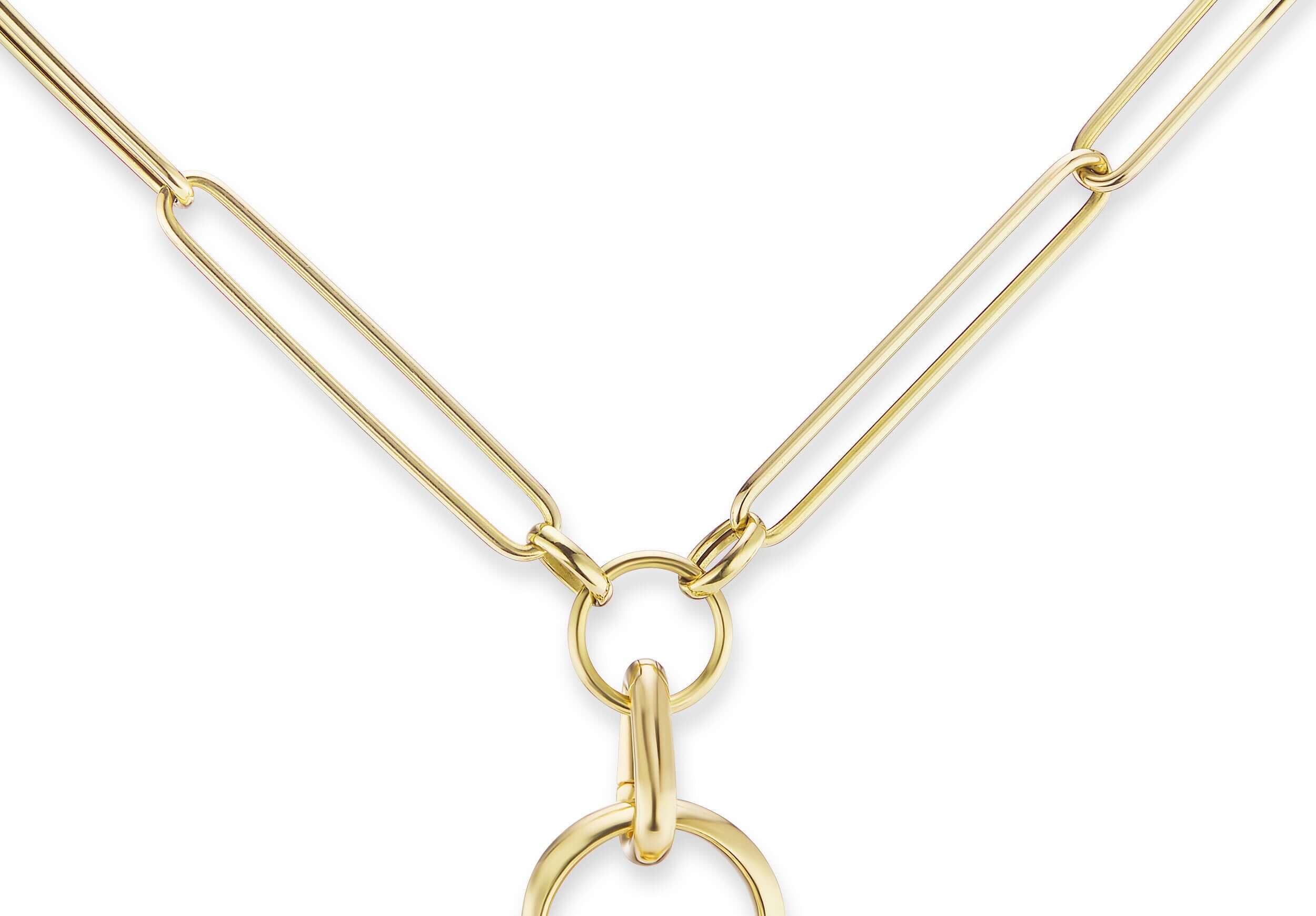 An 18k yellow gold chain with a carabiner-style charm holder holding a gold pendant. This adorable clip open ‘carabiner-style’ to accommodate additional charms and pendants to create a gold necklace out of any gold chain. Designed by Ana-Katarina Fine Jewelry. 