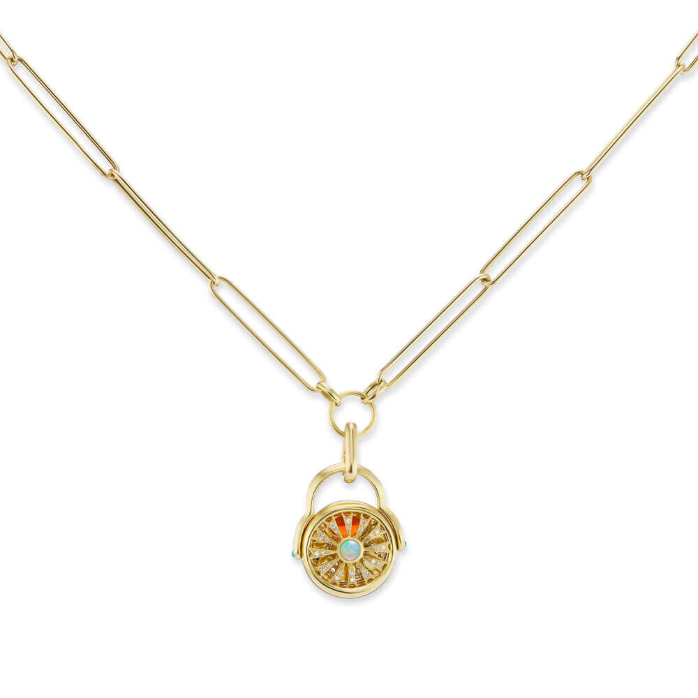 An 18k yellow gold paperclip chain with elongated links and a gold loop at the bottom to accommodate gold charms and gold pendants. Here, AK’s carabiner-style charm holder holds the ‘4 Elements: Fire’ gold flip ring (shown with the back side of the ring facing forward) to convert it to a necklace. Designed by Ana-Katarina Fine Jewelry. 