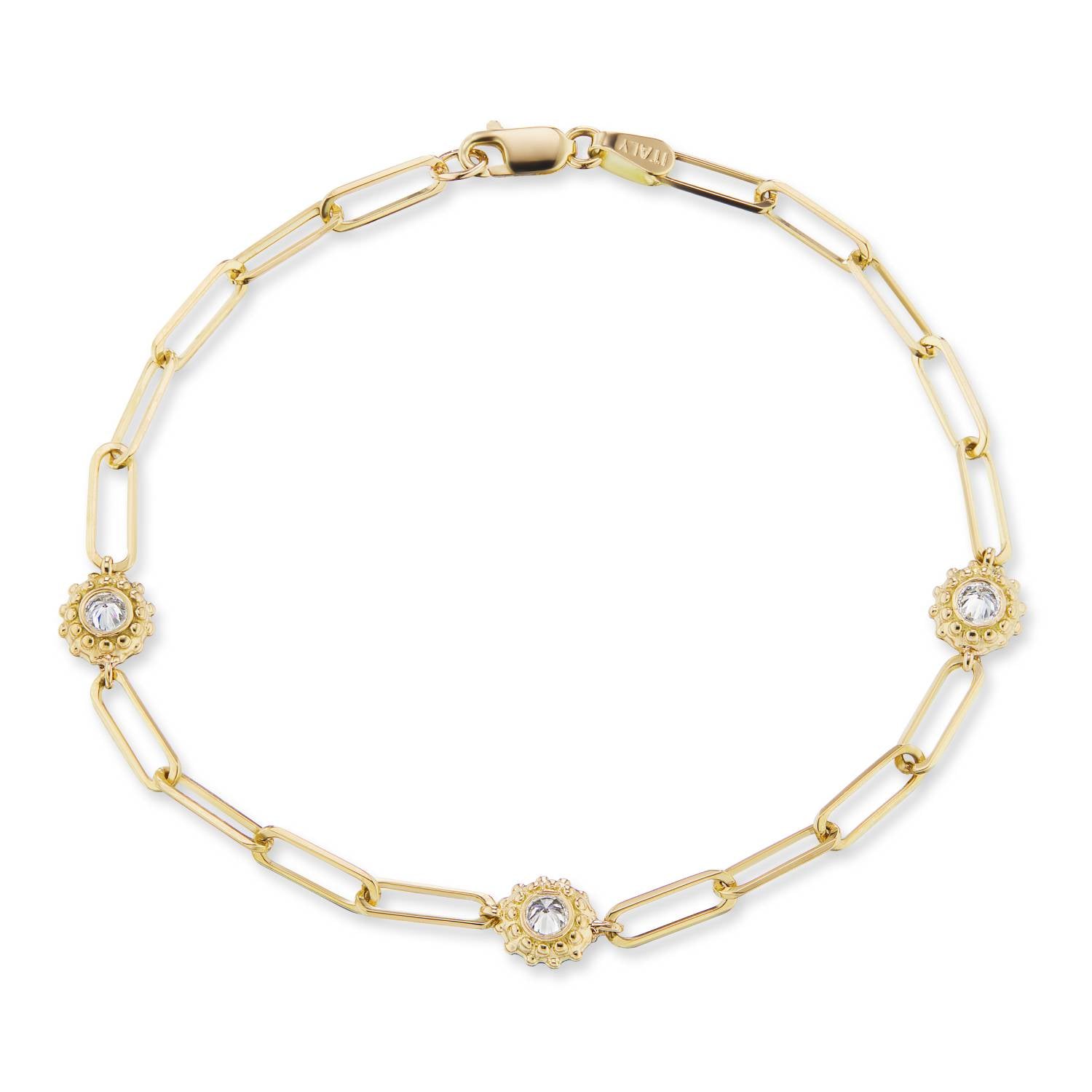 An 18k yellow gold diamond solitaire bracelet with an adjustable 7” paperclip chain with a lobster claw clasp. The settings for the inverted diamonds are designed to resemble a delicate sea urchin with soft gold beading by Ana-Katarina Fine Jewelry. 