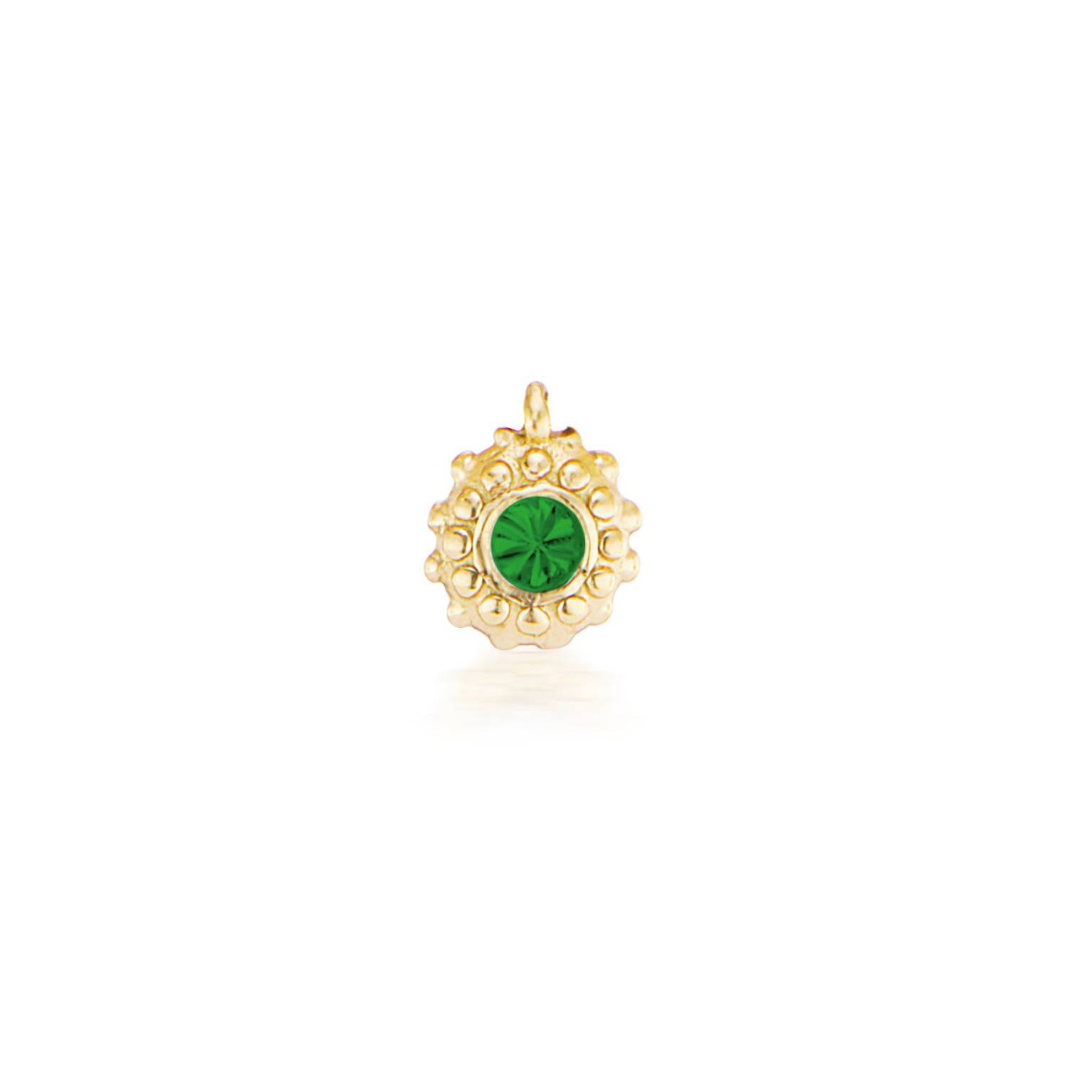 An 18k yellow gold circular charm with raised soft 'spikes' and an inverted emerald for the May / Taurus birthstone in the center. 