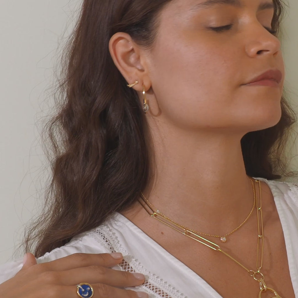 A video of a person modeling Ana-Katarina's 4 Elements: 'Air' Shooting Star Stud Earring Single in 18 yellow gold - styled with other pieces from the 4 Elements: ‘Air’ Collection.