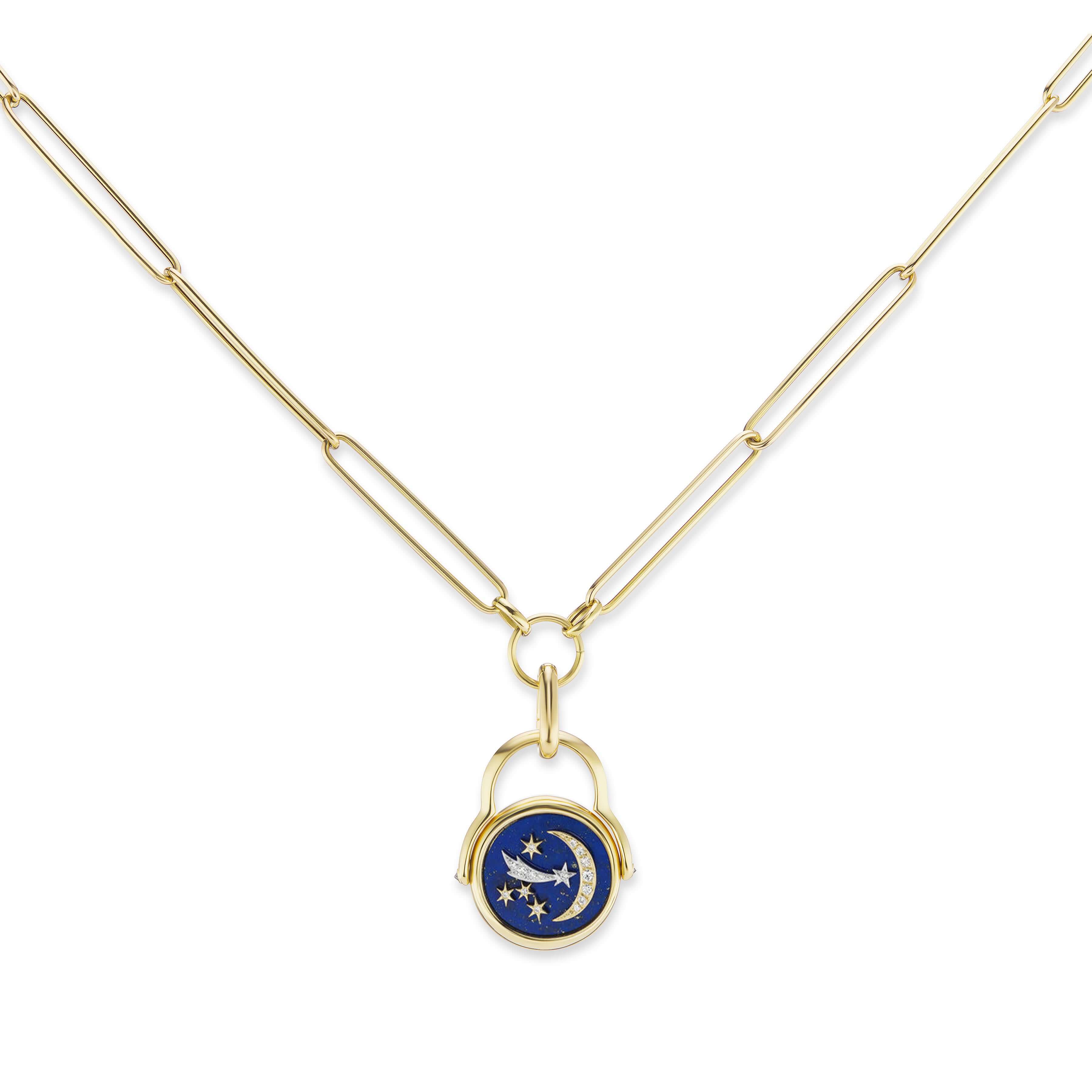 A gold necklace with a blue and white star pendant, featuring Ana-Katarina's 4 Elements Air Flip Ring.